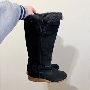 Black suede knee-high boots with faux fur trim